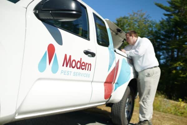 Modern Pest truck and service professional