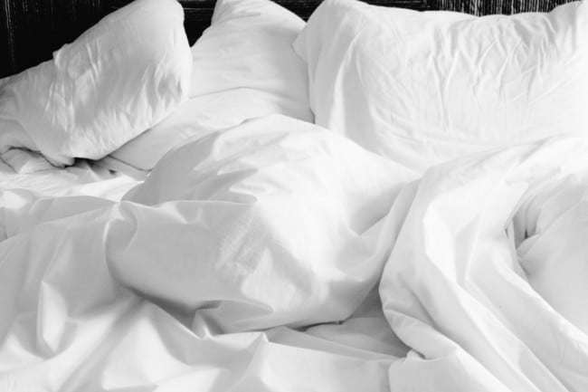 White pillows on white sheets